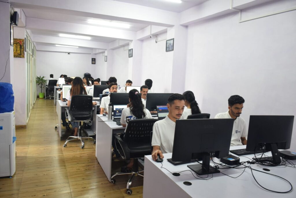 Employees of Gashwa Institute of Technical Education engaged in computer work within a collaborative office space.