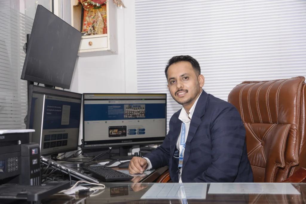 Gashwa Technologies director working in a web development office