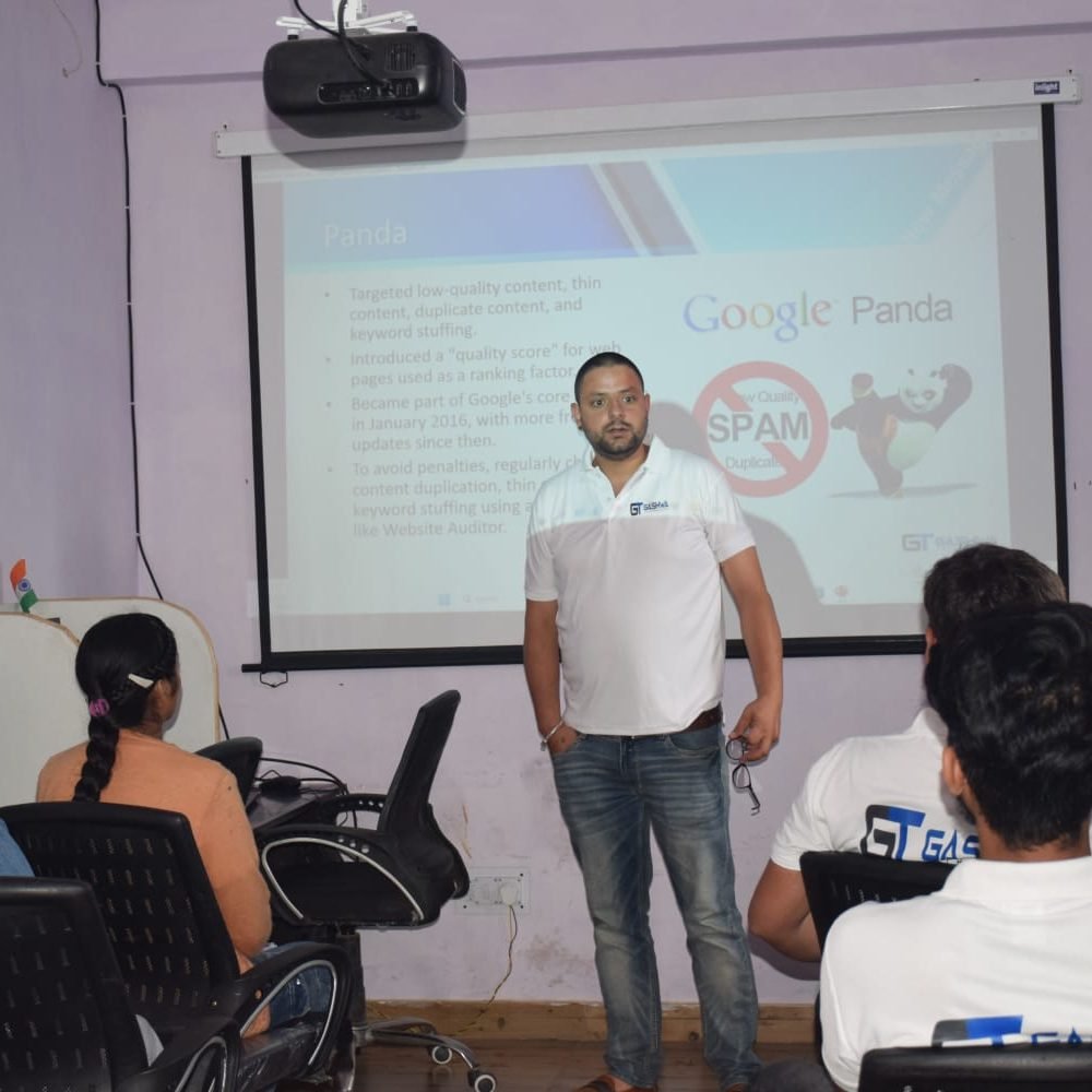 A man delivers a presentation to students at Gashwa Technologies Private Limited during a training session.