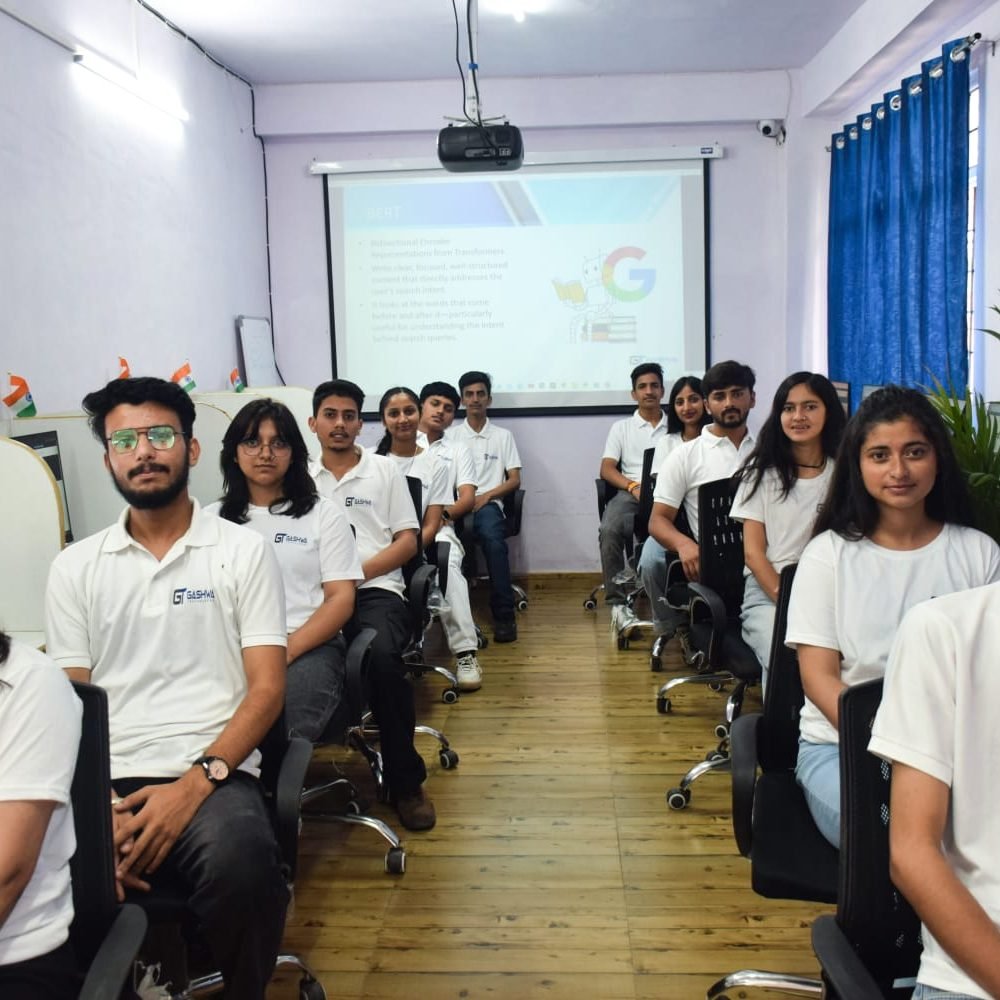 Students in white shirts focused on their computers during a training program at Gashwa Technologies Private Limited.